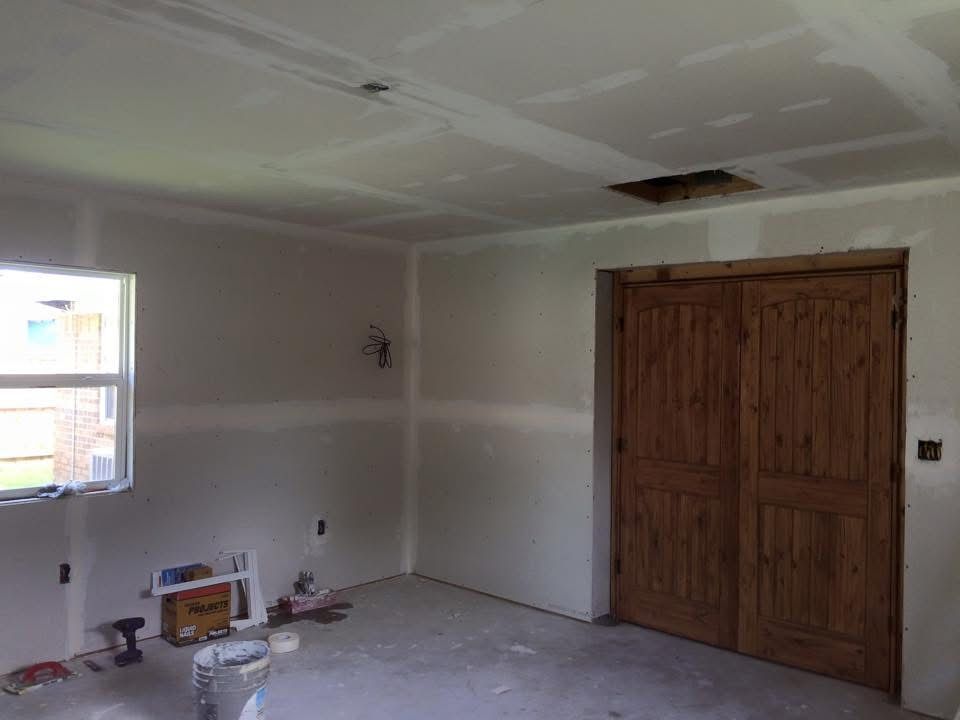 New drywall hung and taped in a home addition