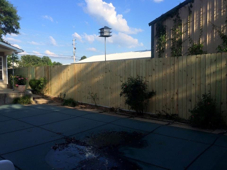 New wood privacy fence around a backyard patio