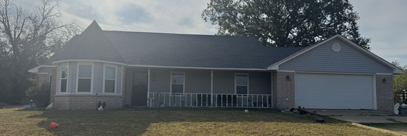 Ranch-style home with a new dark shingle roof